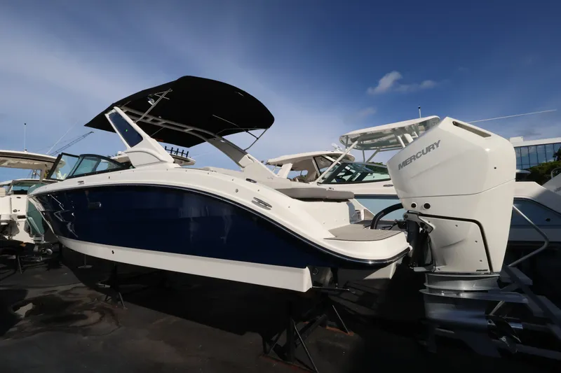 Slide: The Image of A 2027 Sea Ray SDX 270 Outboard with a blue hull and white outboard motor. - 2