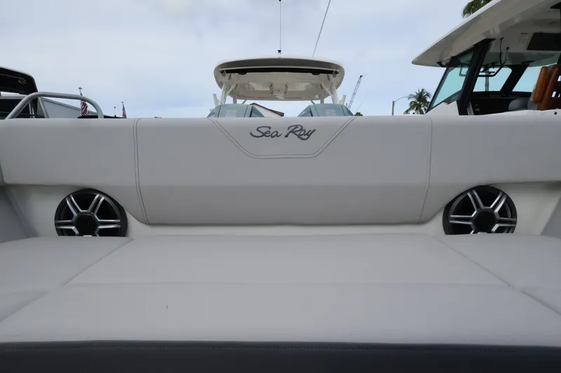 Slide: The Image of Rear view of a Sea Ray SDX 270 Outboard with white upholstery and speakers. - 29