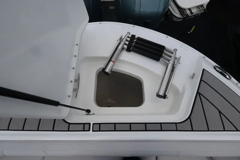 Slide: The Image of A view of the Sea Ray SDX 270 Outboard deck with storage and stainless steel accessories. - 30