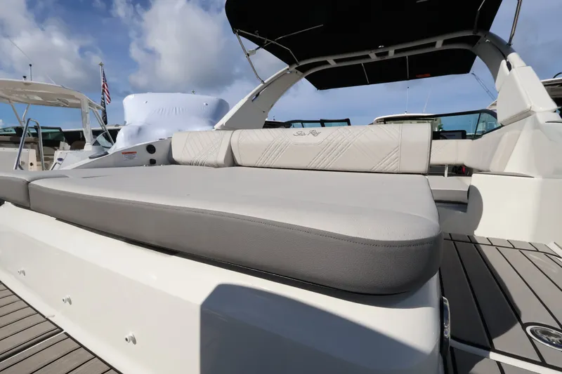 Slide: The Image of The image shows the spacious aft deck of a Sea Ray SDX 270 Outboard with comfortable seating. - 8