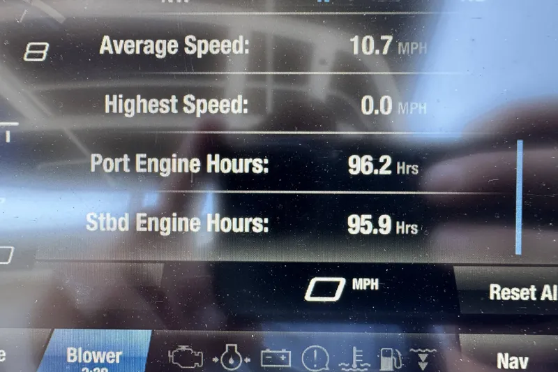 Slide: The Image of Display screen of 2023 Yamaha Boats 252SE showing engine hours and speed metrics. - 19