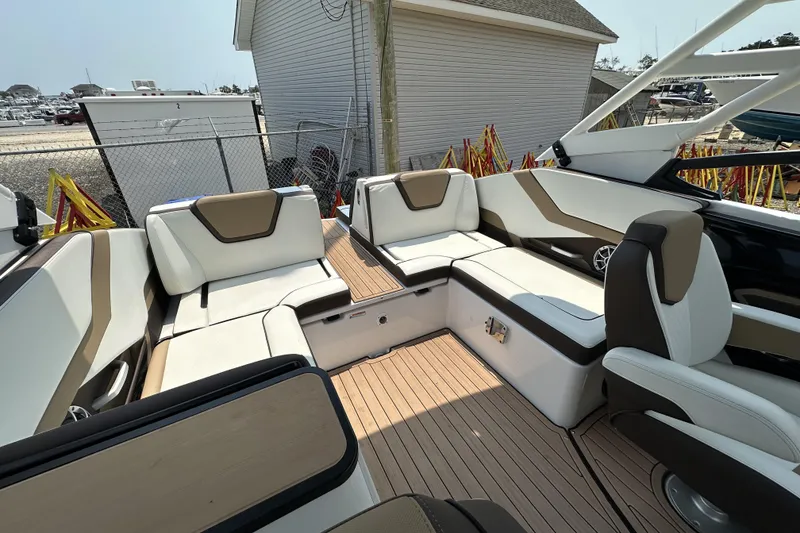 Slide: The Image of 2023 Yamaha Boats 252SE interior with luxurious seating and modern design. - 7