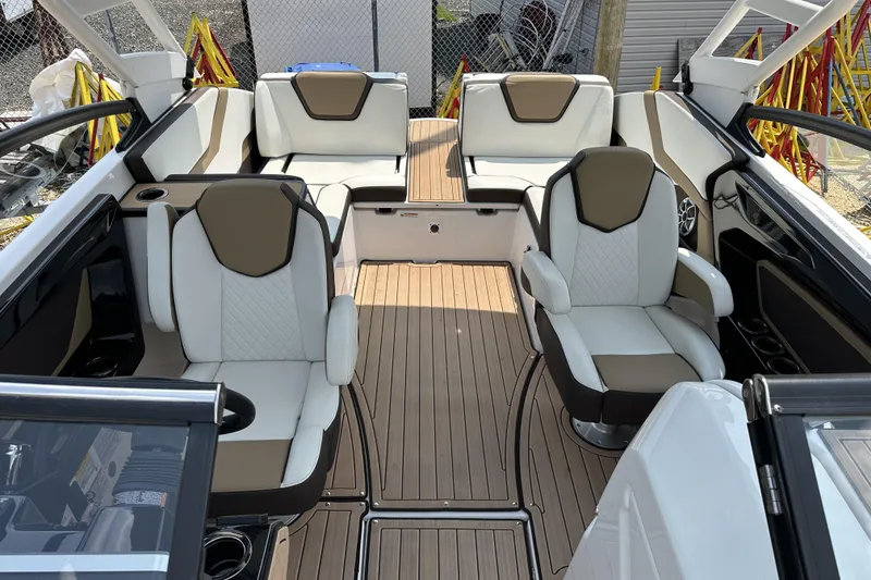 Slide: The Image of 2023 Yamaha Boats 252SE interior with luxurious seating and sleek design. - 5