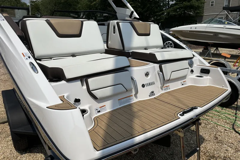 Slide: The Image of 2023 Yamaha Boats 252SE with sleek seating and modern design on display. - 11