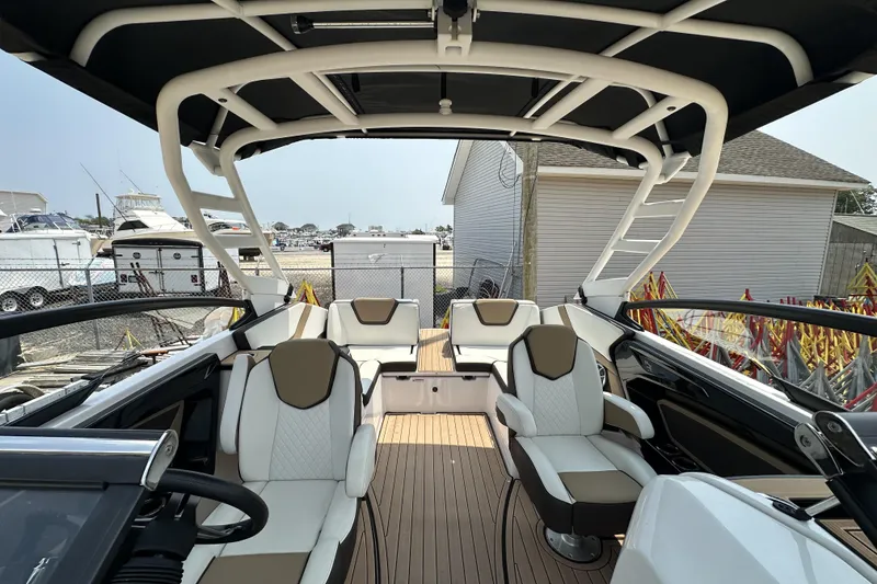 Slide: The Image of 2023 Yamaha Boats 252SE interior with luxurious seating and modern design. - 6