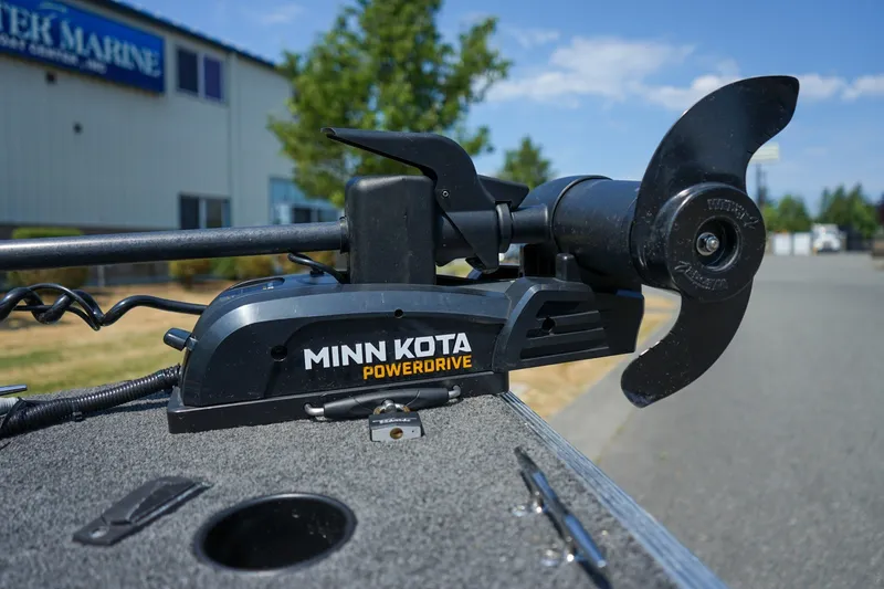 Slide: The Image of Minn Kota PowerDrive motor on 2015 Lund 1400 Fury SS boat, outdoor setting. - 14