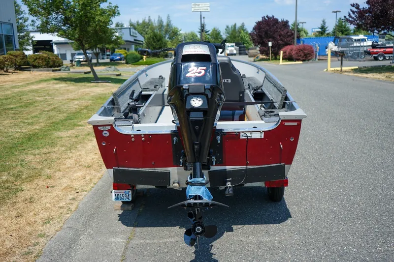 Slide: The Image of 2015 Lund 1400 Fury SS boat with outboard motor on a trailer. - 4