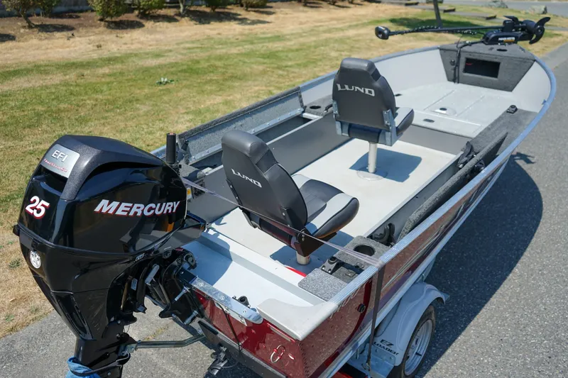Slide: The Image of 2015 Lund 1400 Fury SS boat with Mercury 25 EFI outboard motor on trailer. - 5