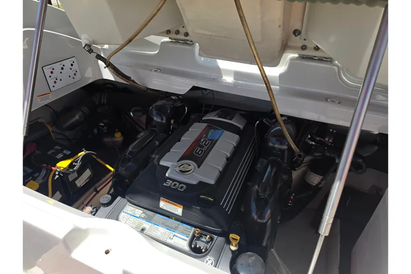 Slide: The Image of Engine compartment of a 2016 Crownline 275 SS boat, featuring a powerful engine. - 25