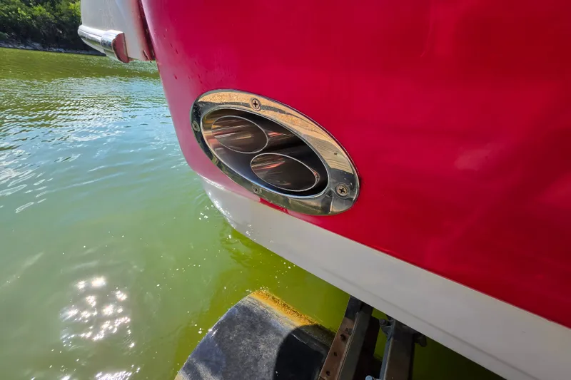 Slide: The Image of Close-up of 2016 Crownline 275 SS boat exhaust in water. - 12