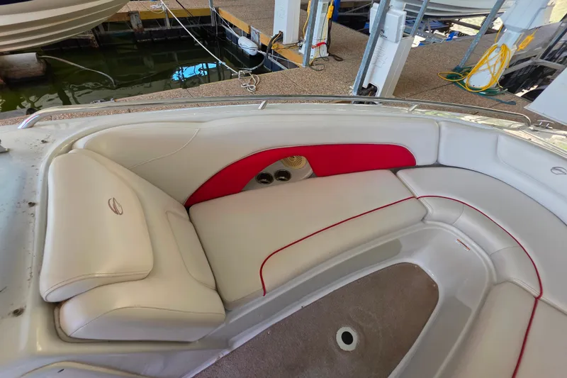 Slide: The Image of 2016 Crownline 275 SS boat interior with white and red seating. - 33