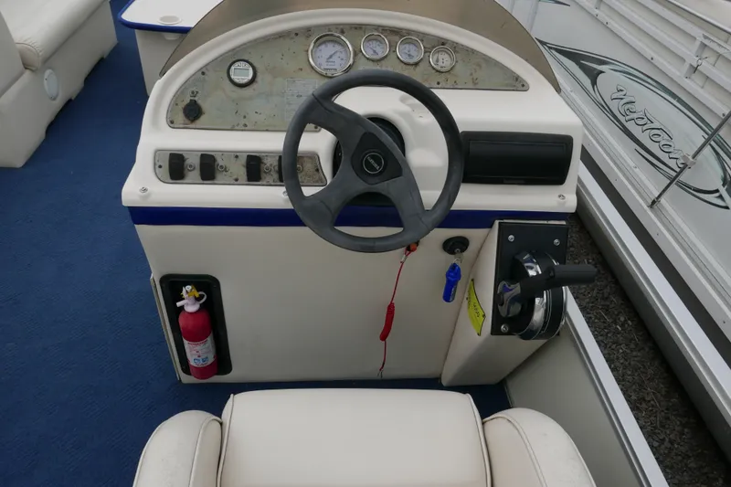 Slide: The Image of Steering console of a 2002 Crest 20 Sport boat with gauges and controls. - 10