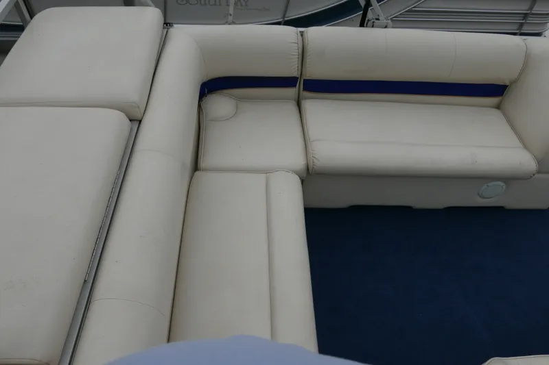 Slide: The Image of Interior seating of a 2002 Crest 20 Sport boat with white upholstery. - 11