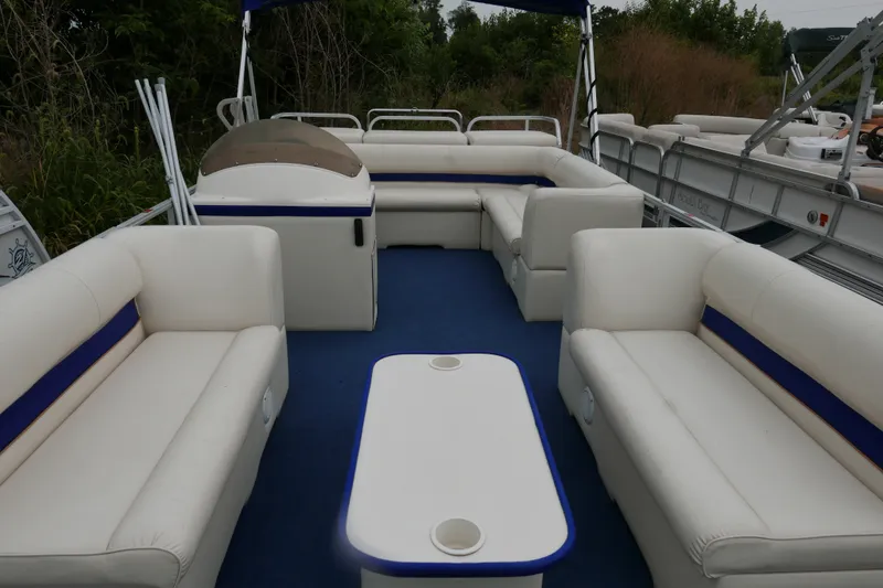 Slide: The Image of 2002 Crest 20 Sport pontoon boat with spacious seating and blue accents. - 4
