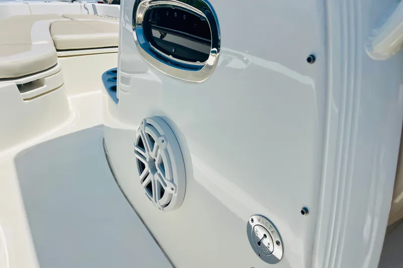 Slide: The Image of 2018 Boston Whaler 240 Dauntless boat interior with speaker and seating detail. - 23
