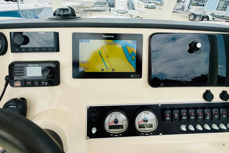 Slide: The Image of Dashboard of a 2018 Boston Whaler 240 Dauntless with navigation and control instruments. - 20