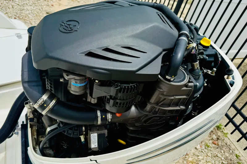 Slide: The Image of Close-up of a 2018 Boston Whaler 240 Dauntless boat engine, showcasing intricate details. - 27