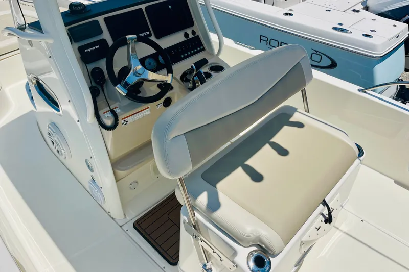 Slide: The Image of 2018 Boston Whaler 240 Dauntless helm with steering wheel and seating. - 15