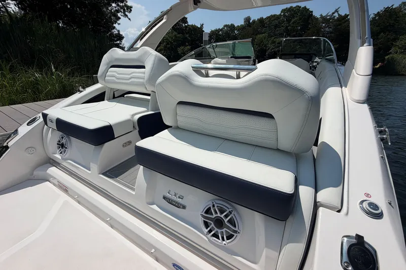 Slide: The Image of 2027 Regal LX9 boat interior with luxurious seating and premium audio system. - 5