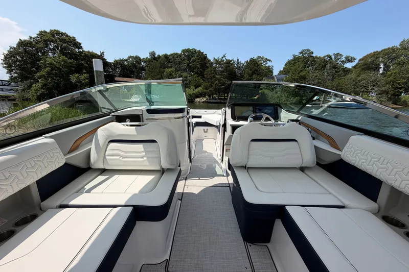 Slide: The Image of Luxurious 2027 Regal LX9 boat interior with plush seating and sleek design. - 13