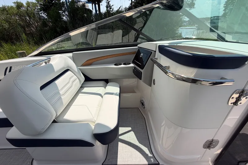 Slide: The Image of Luxurious interior of 2027 Regal LX9 boat with sleek seating and modern dashboard design. - 16