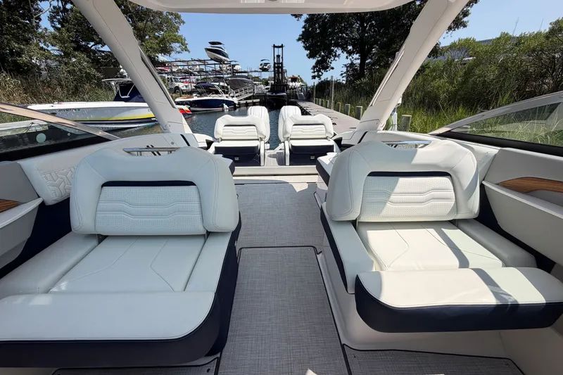 Slide: The Image of Luxurious interior of a 2027 Regal LX9 boat docked by the water. - 15