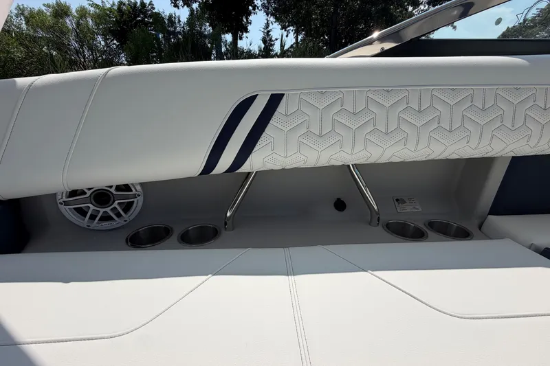 Slide: The Image of Interior of 2027 Regal LX9 boat with stylish seating and cup holders. - 14