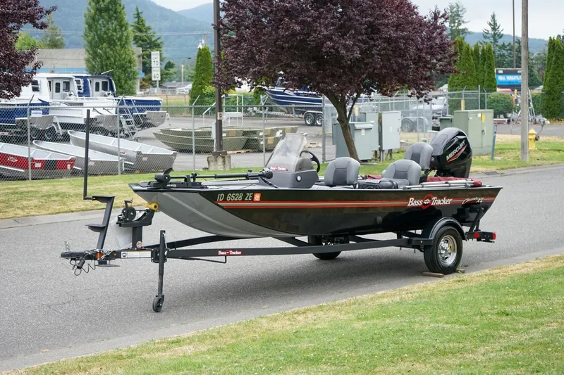 Slide: The Image of 2026 Tracker Bass Tracker Classic CC boat on trailer, parked outdoors. - 15