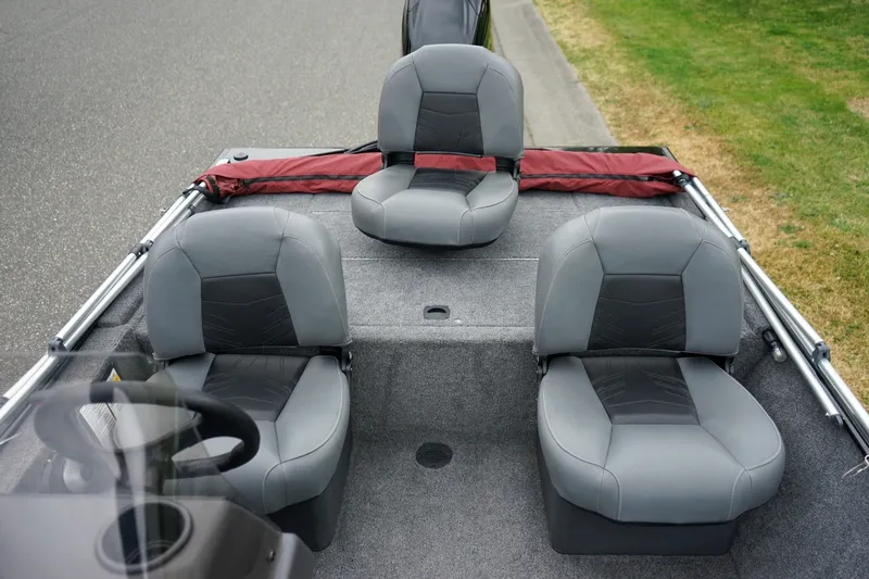 Slide: The Image of 2026 Tracker Bass Tracker Classic CC boat interior with three gray seats. - 7