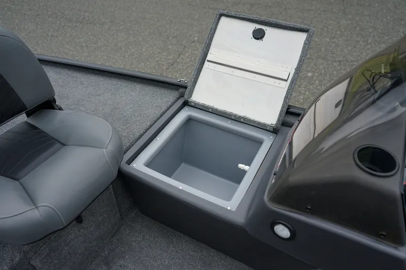 Slide: The Image of 2026 Tracker Bass Tracker Classic CC boat interior with open storage compartment and seating. - 11