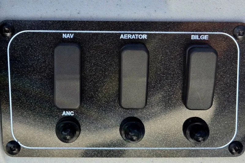 Slide: The Image of Control panel of 2026 Tracker Bass Tracker Classic CC with NAV, Aerator, Bilge switches. - 22