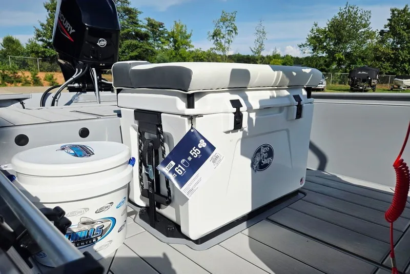 Slide: The Image of 2026 Tracker Bass Tracker Classic CC boat with cooler and fishing gear on deck. - 19