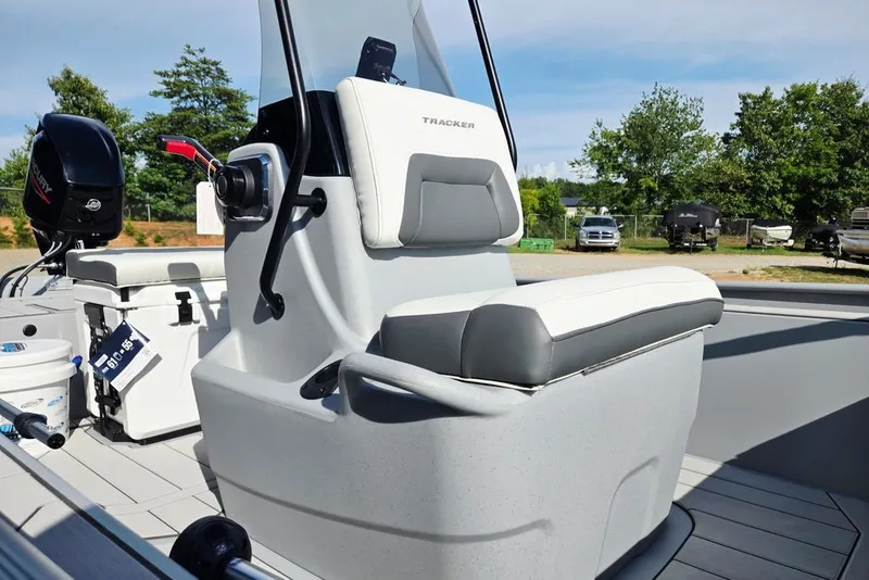Slide: The Image of 2026 Tracker Bass Tracker Classic CC boat interior with steering console and seating. - 20
