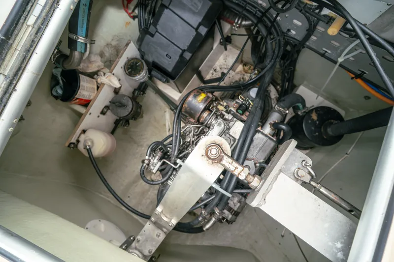 Slide: The Image of Engine compartment of a 2011 Leopard 38 catamaran, showcasing mechanical components and wiring. - 147
