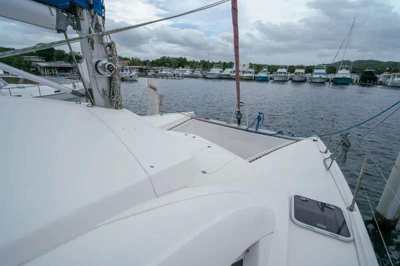 Slide: The Image of 2011 Leopard 38 catamaran docked at marina with overcast sky. - 42