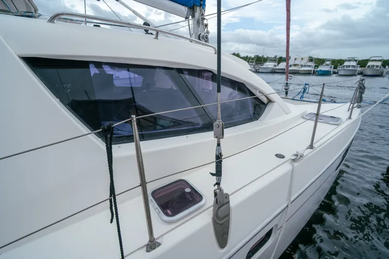 Slide: The Image of 2011 Leopard 38 catamaran docked, showcasing sleek design and modern features. - 16