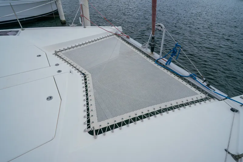 Slide: The Image of Catamaran deck with netting, Leopard 38 model, 2011, on calm water. - 40