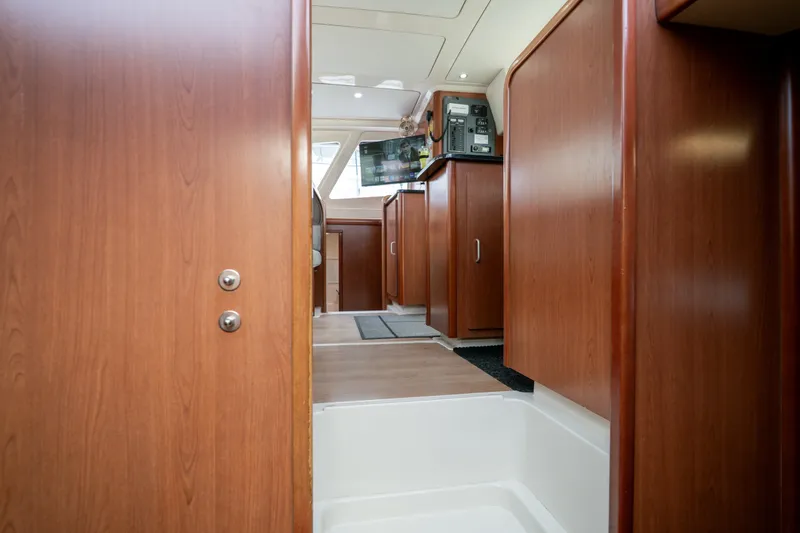 Slide: The Image of Interior of 2011 Leopard 38 yacht with wooden cabinetry and modern design. - 98