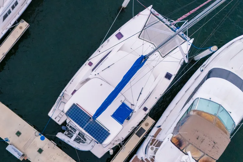 Slide: The Image of Aerial view of a 2011 Leopard 38 catamaran docked at a marina. - 6