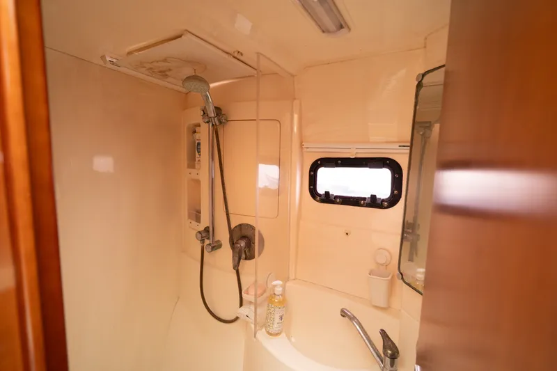 Slide: The Image of Bathroom interior of a 2011 Leopard 38 yacht with shower and sink. - 88