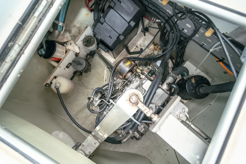 Slide: The Image of Engine compartment of a 2011 Leopard 38 yacht, showcasing mechanical components and wiring. - 149