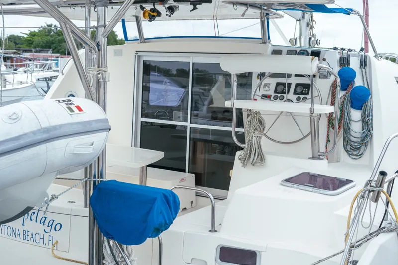 Slide: The Image of 2011 Leopard 38 catamaran cockpit with navigation instruments and mooring ropes. - 69