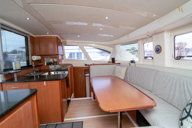 Slide: The Image of Interior of a 2011 Leopard 38 catamaran with kitchen and dining area. - 110