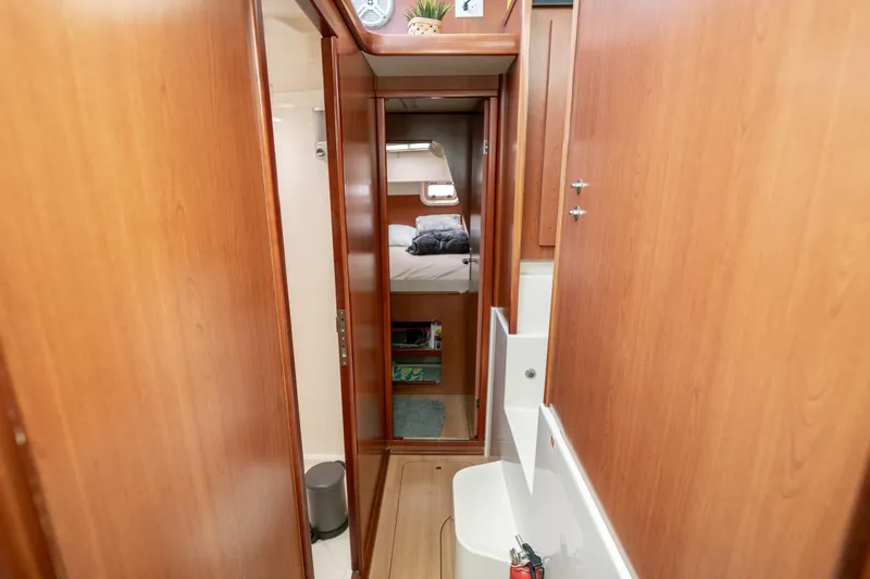 Slide: The Image of Interior of 2011 Leopard 38 yacht with wooden cabinetry and cozy bedroom. - 126