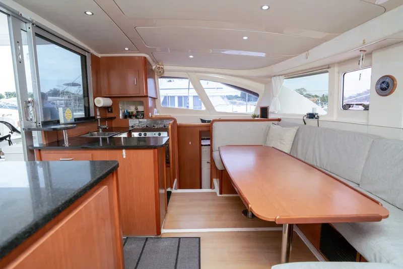 Slide: The Image of Interior of a 2011 Leopard 38 yacht with modern kitchen and cozy seating area. - 111