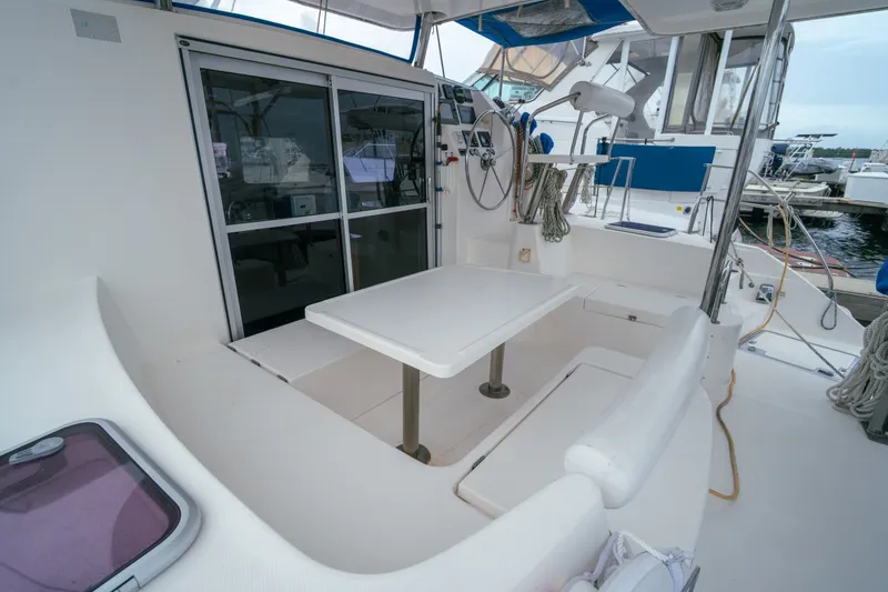 Slide: The Image of Spacious cockpit of a 2011 Leopard 38 catamaran with seating and helm station. - 28
