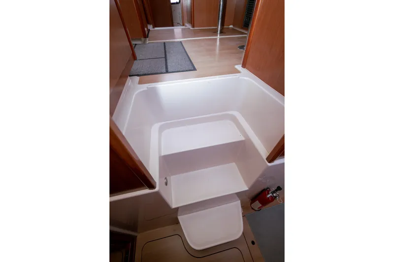 Slide: The Image of Interior of 2011 Leopard 38 yacht showing steps and wooden flooring. - 129