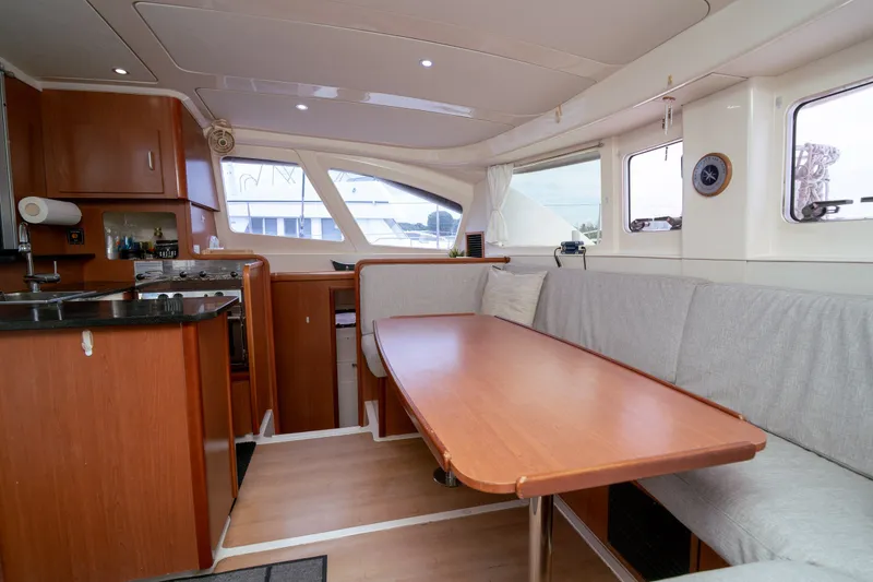 Slide: The Image of Interior of a 2011 Leopard 38 catamaran with kitchen and dining area. - 114