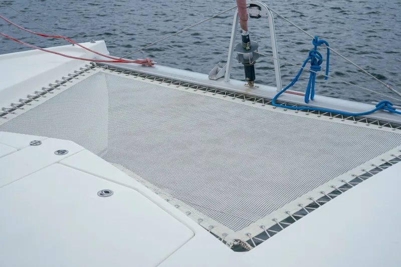Slide: The Image of Catamaran deck with netting, Leopard 38, 2011 model, on calm water. - 77