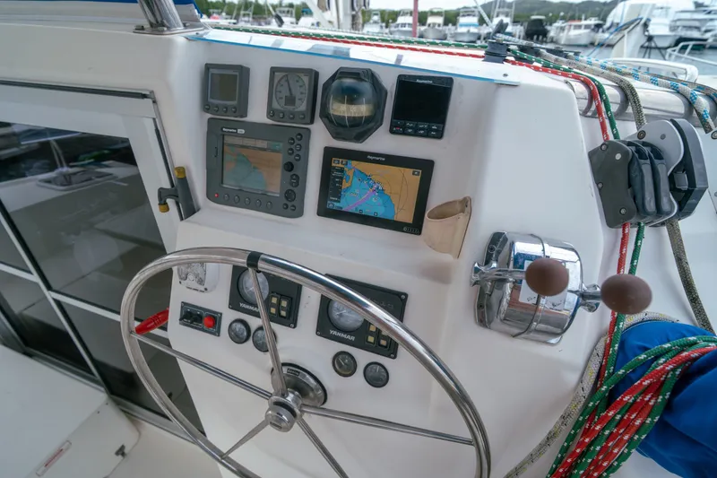 Slide: The Image of Cockpit of 2011 Leopard 38 sailboat with navigation instruments and steering wheel. - 25